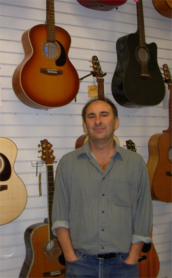 Dave Byron teaches guitar lessons at Jansen Music store in Aptos, CA